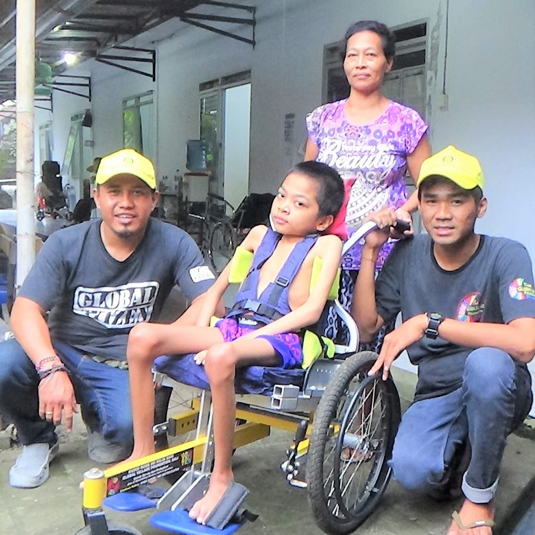 A new wheelchair for Komang. age 12